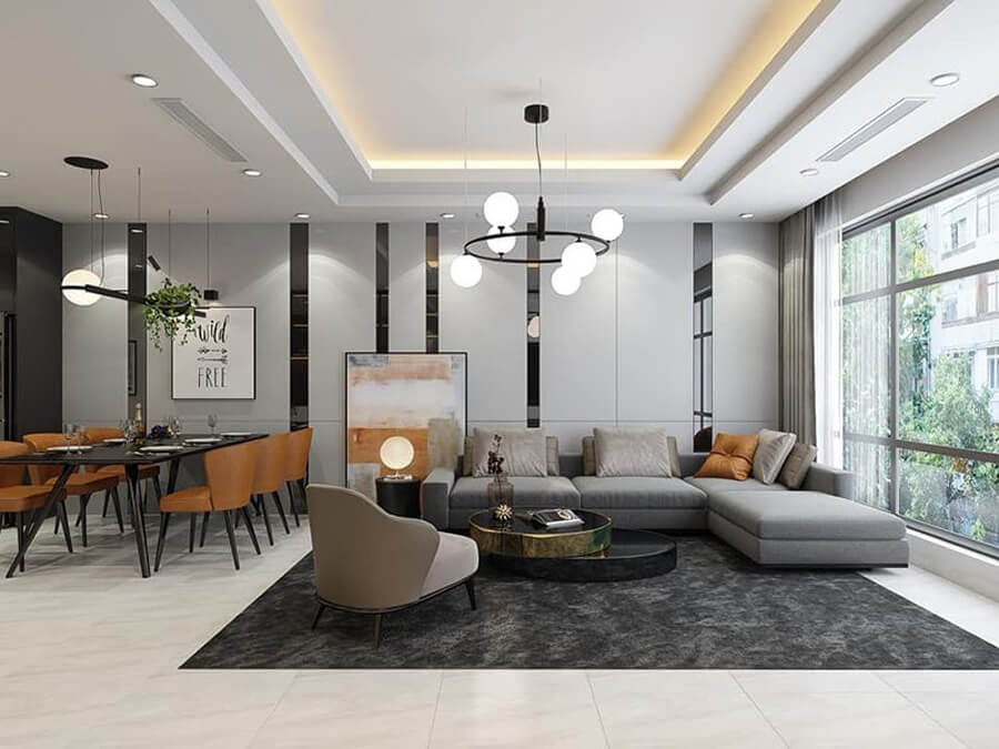 Phòng khách chung cư trên 100m² với trần cao, sofa lớn bọc da, bàn trà đá tự nhiên và đèn chùm hiện đại