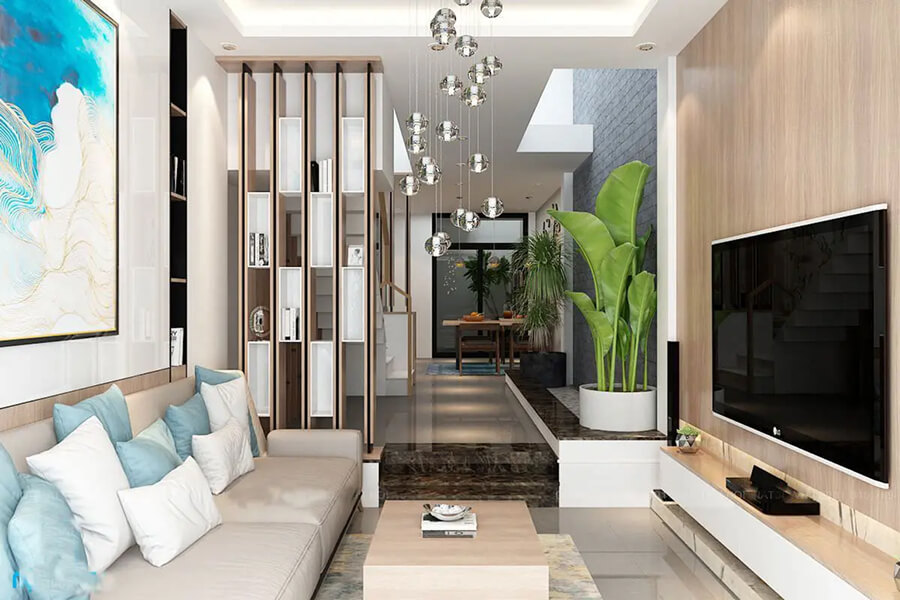Phòng khách nhà ống hiện đại với sofa dài kê sát tường, đèn led âm trần và vách gỗ trang trí sau tivi