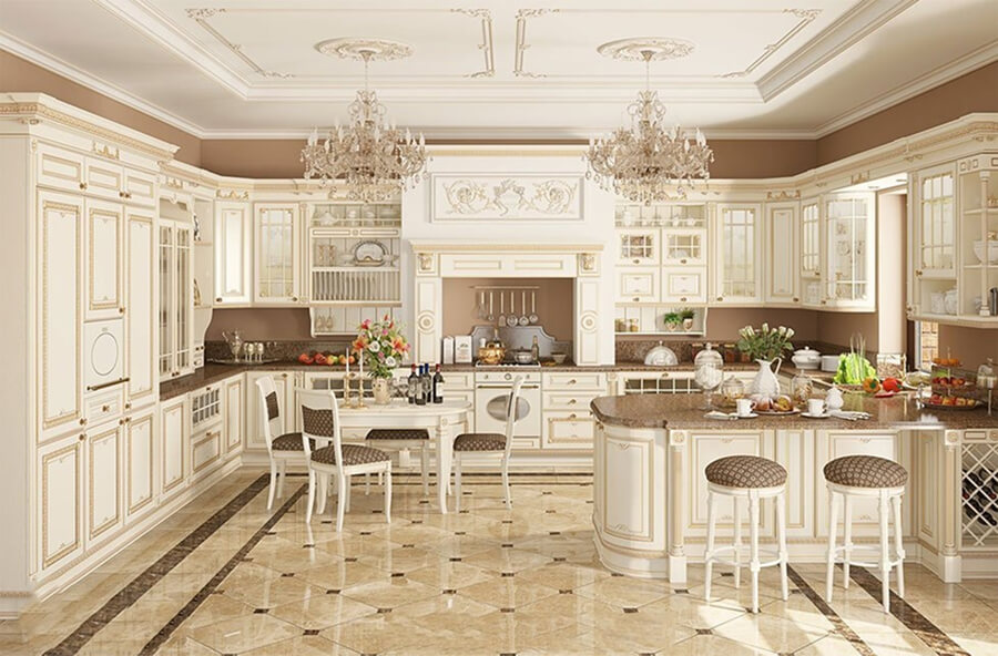 Không gian bếp biệt thự phong cách tân cổ điển với tủ bếp gỗ sơn trắng, mặt đá granite và đèn thả kiểu châu Âu
