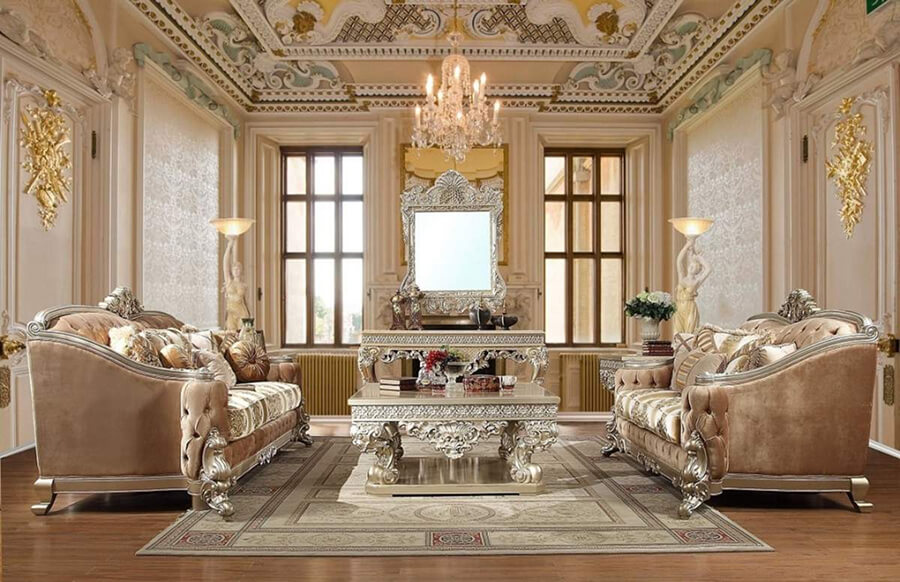 Phòng khách biệt thự sang trọng với trần cao, đèn chùm pha lê lớn và bộ sofa bọc nỉ cao cấp tông màu trung tính