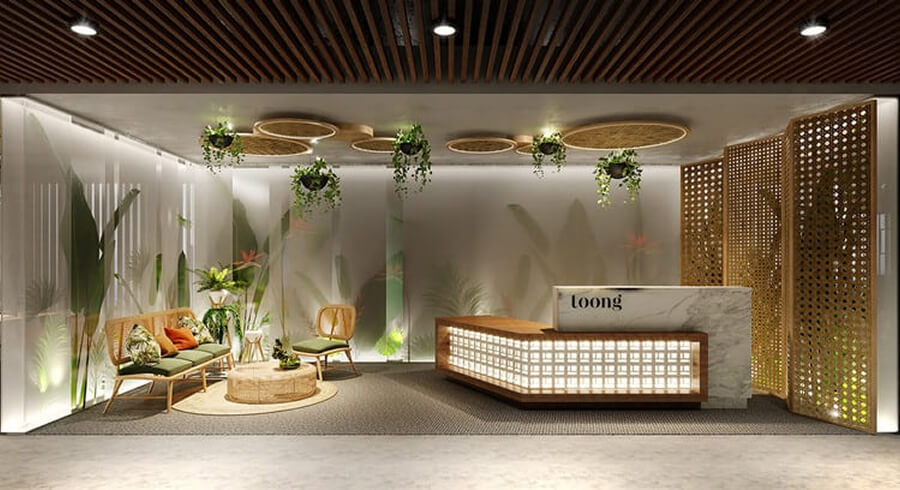 Không gian tiếp khách văn phòng với sofa nỉ cao cấp, bàn trà tròn và tranh trang trí tinh tế