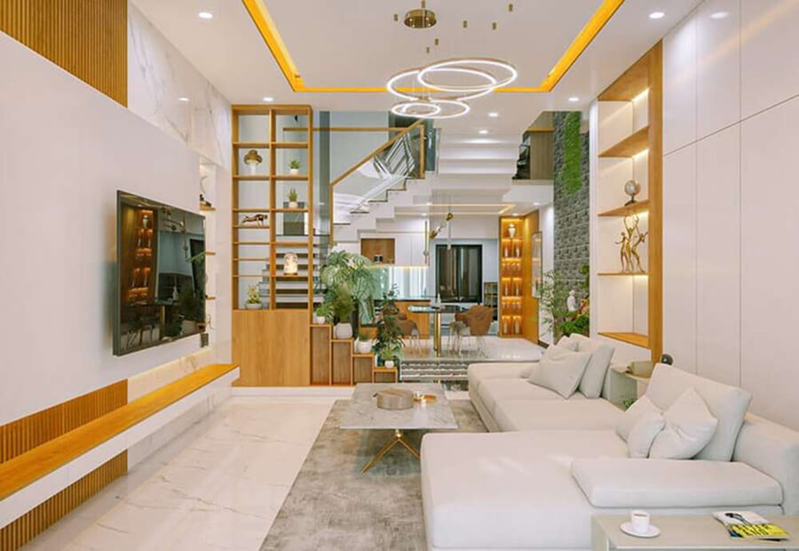 Phòng khách liền cầu thang nhà ống có tay vịn kính cường lực, tạo cảm giác thoáng đãng và kết nối không gian sinh hoạt